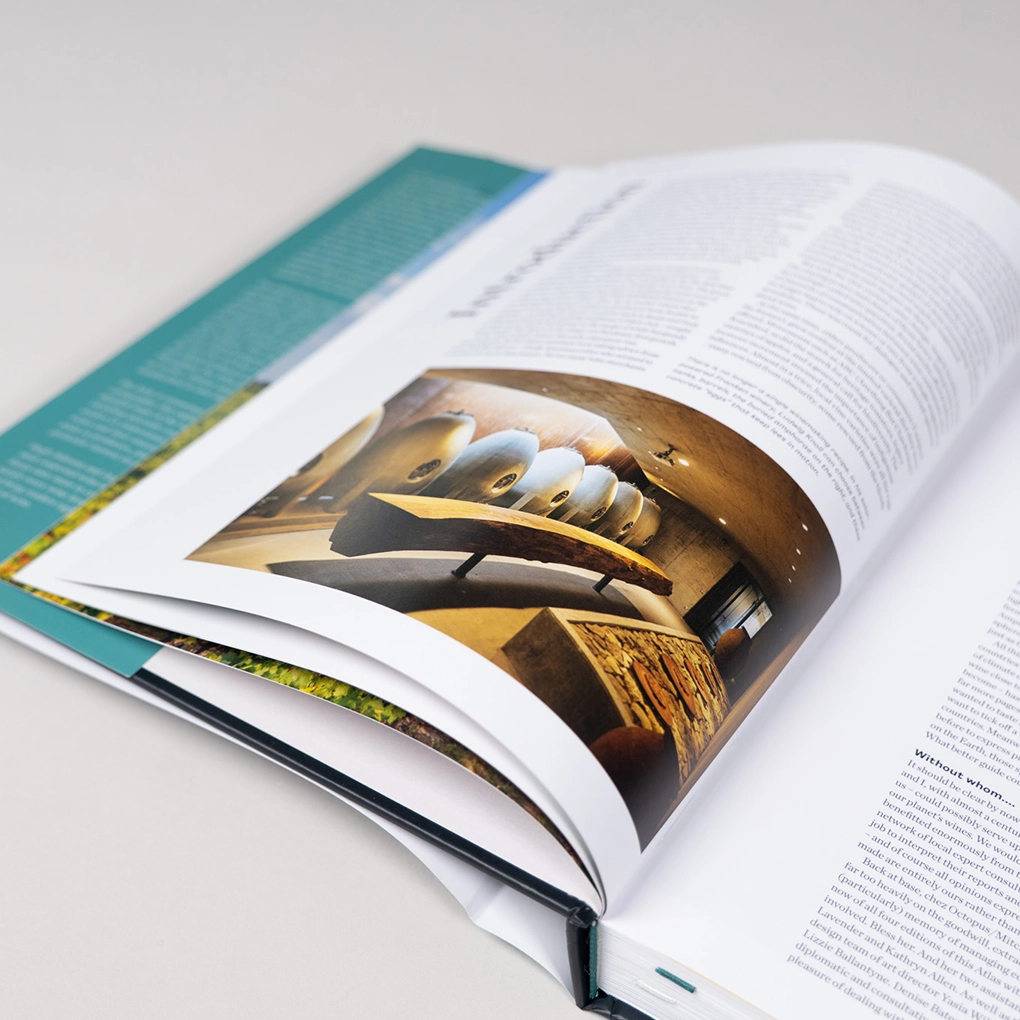 An interior spread showing a photo of winemaking equipment.
